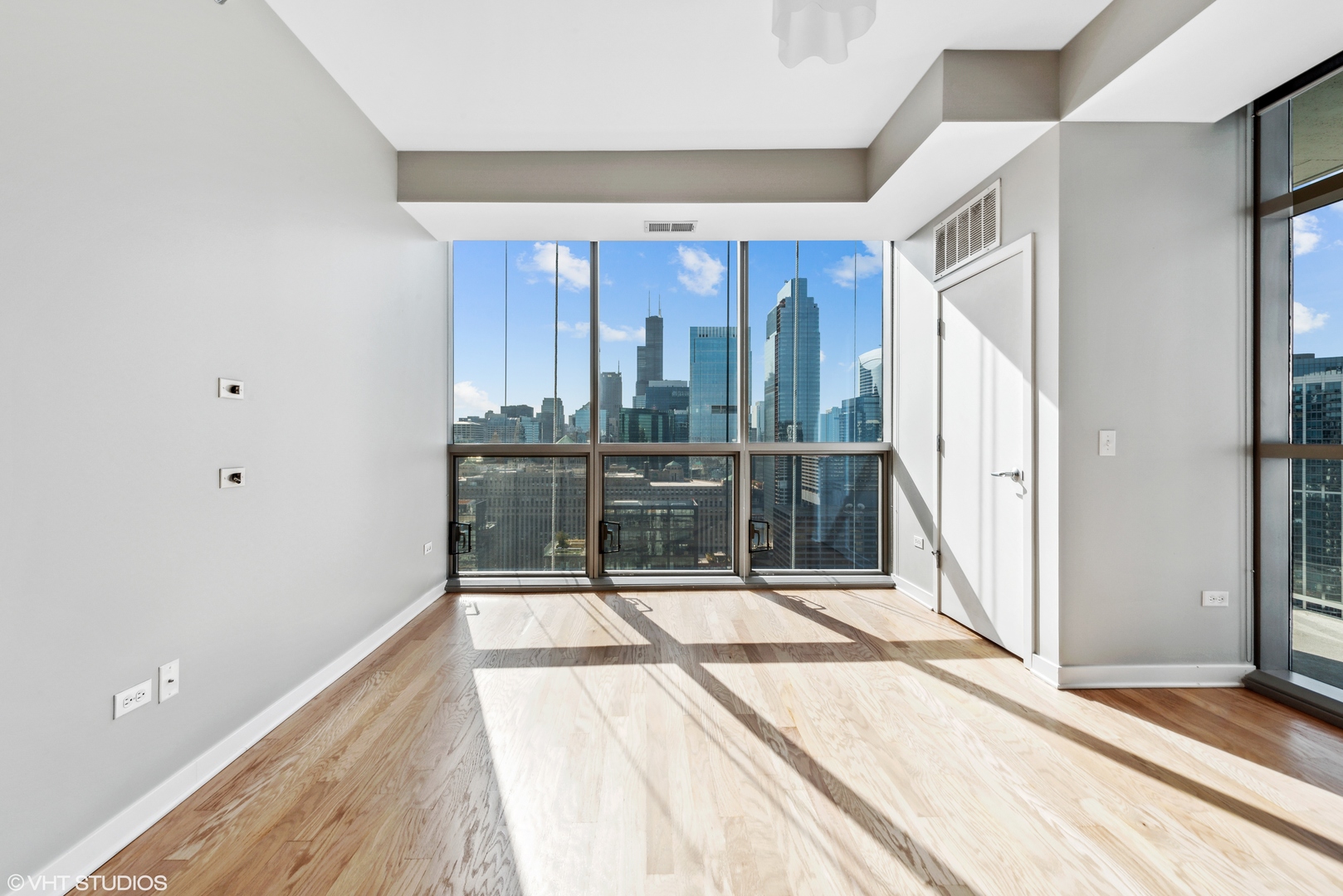 Undisclosed Address Chicago, IL 60654 - Photo 4 of 22 a view of a room with a floor to ceiling window and an entryway