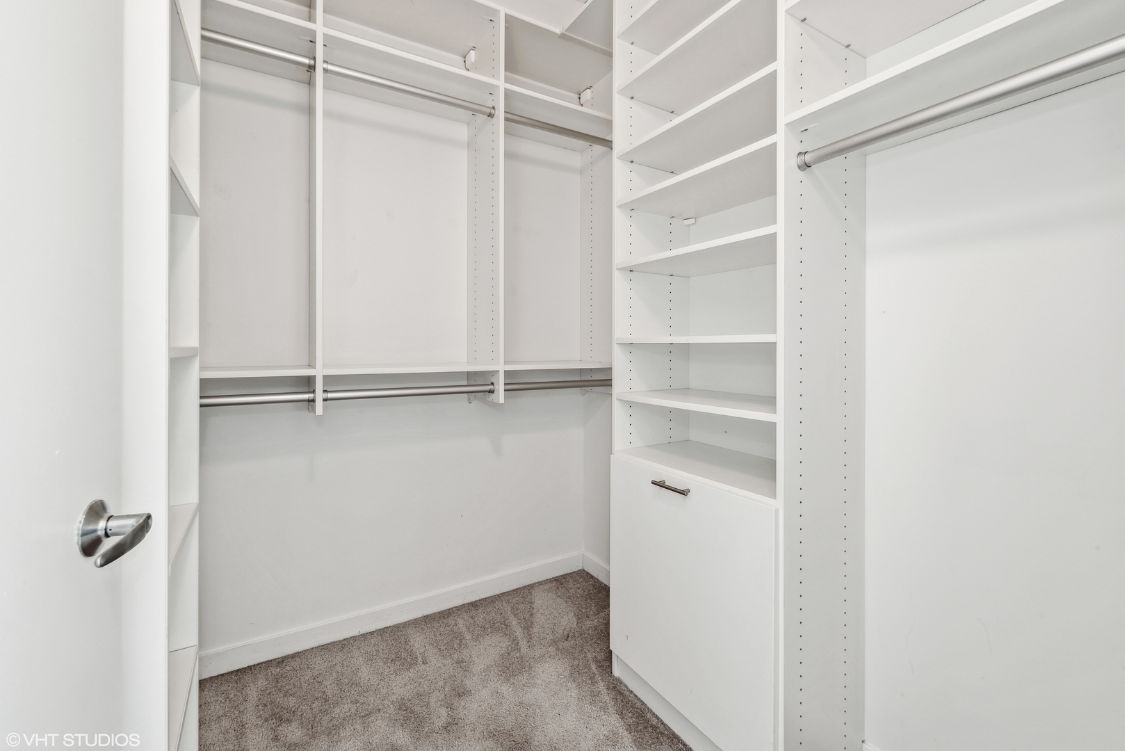 Undisclosed Address Chicago, IL 60654 - Photo 10 of 22 a view of walk in closet with empty racks