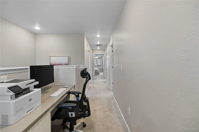 a view of a workspace with furniture