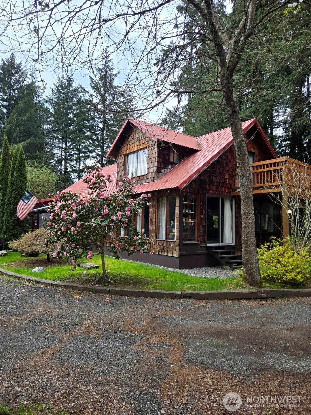 a front view of a house with a yard table and chairs