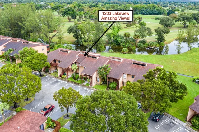 an aerial view of house with yard