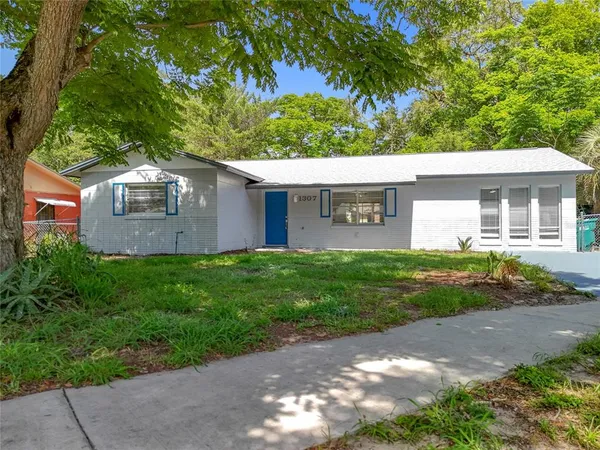 a view of a front of a house with a yard
