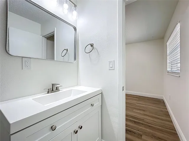 a bathroom with a sink and a mirror