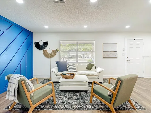 a living room with furniture and a window