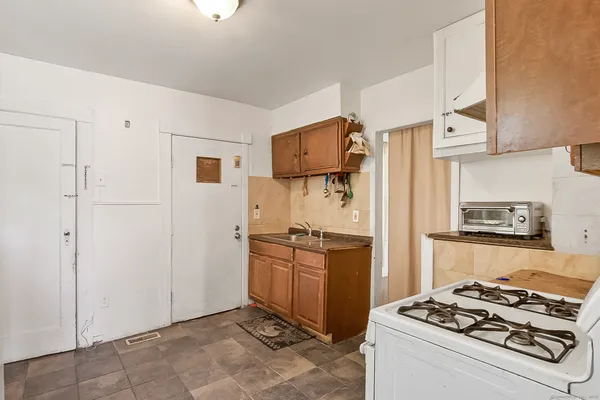 a kitchen with stainless steel appliances granite countertop a stove and a refrigerator