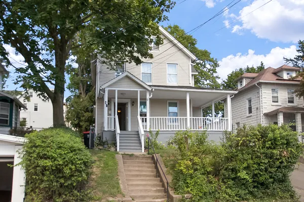 front view of a house with a yard