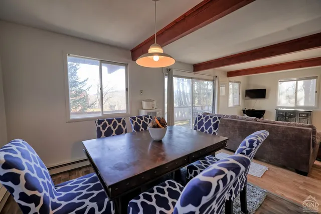 a bedroom with a bed and a mirror