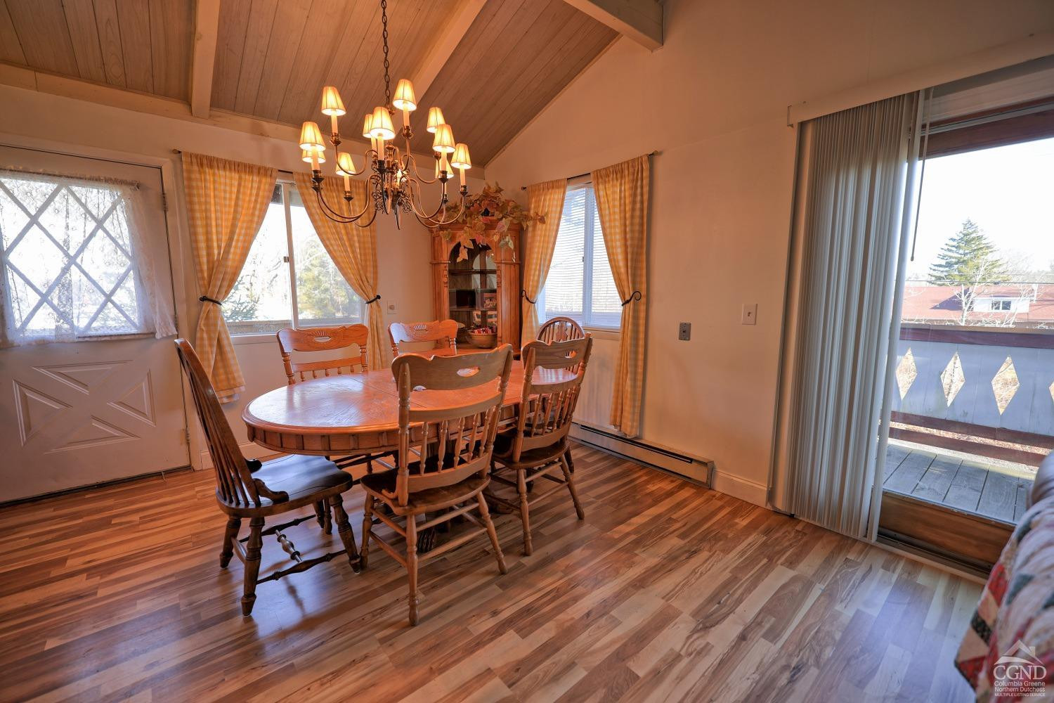 31 Showers Road Hunter, NY 12485 - Photo 48 of 89 a view of a dining room with furniture wooden floor and chandelier
