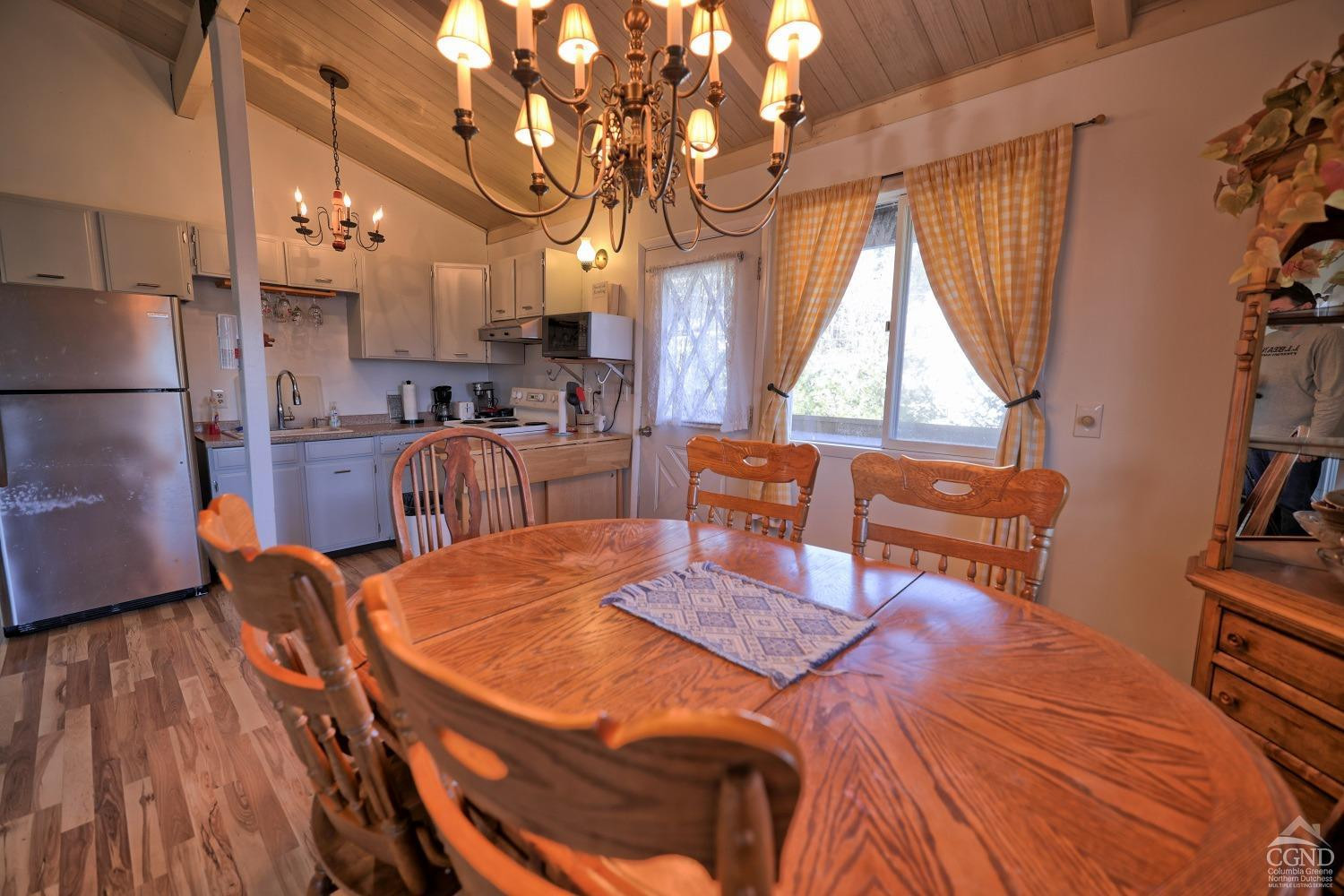 31 Showers Road Hunter, NY 12485 - Photo 50 of 89 a view of a dining room with furniture window and wooden floor