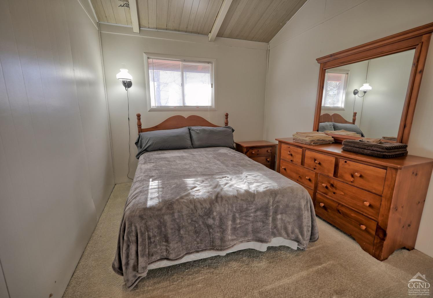 31 Showers Road Hunter, NY 12485 - Photo 62 of 89 a bedroom with a bed and a mirror