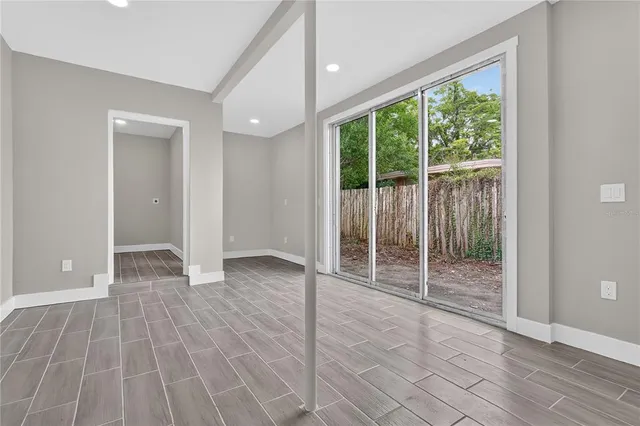 a front view of a house with a garden and plants