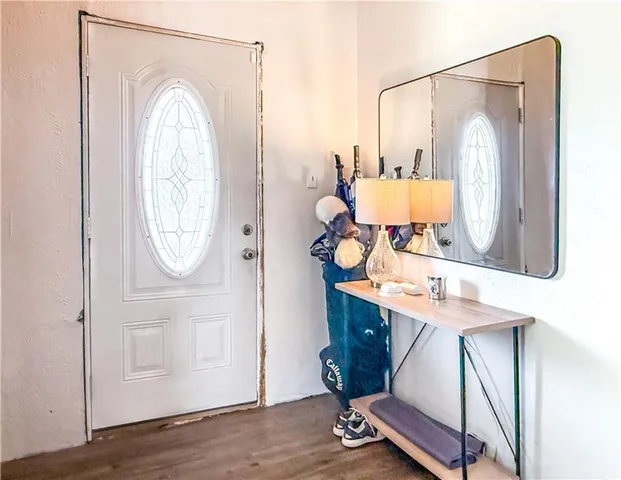 a bathroom with a sink mirror and vanity
