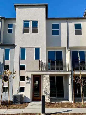 a front view of residential houses with street