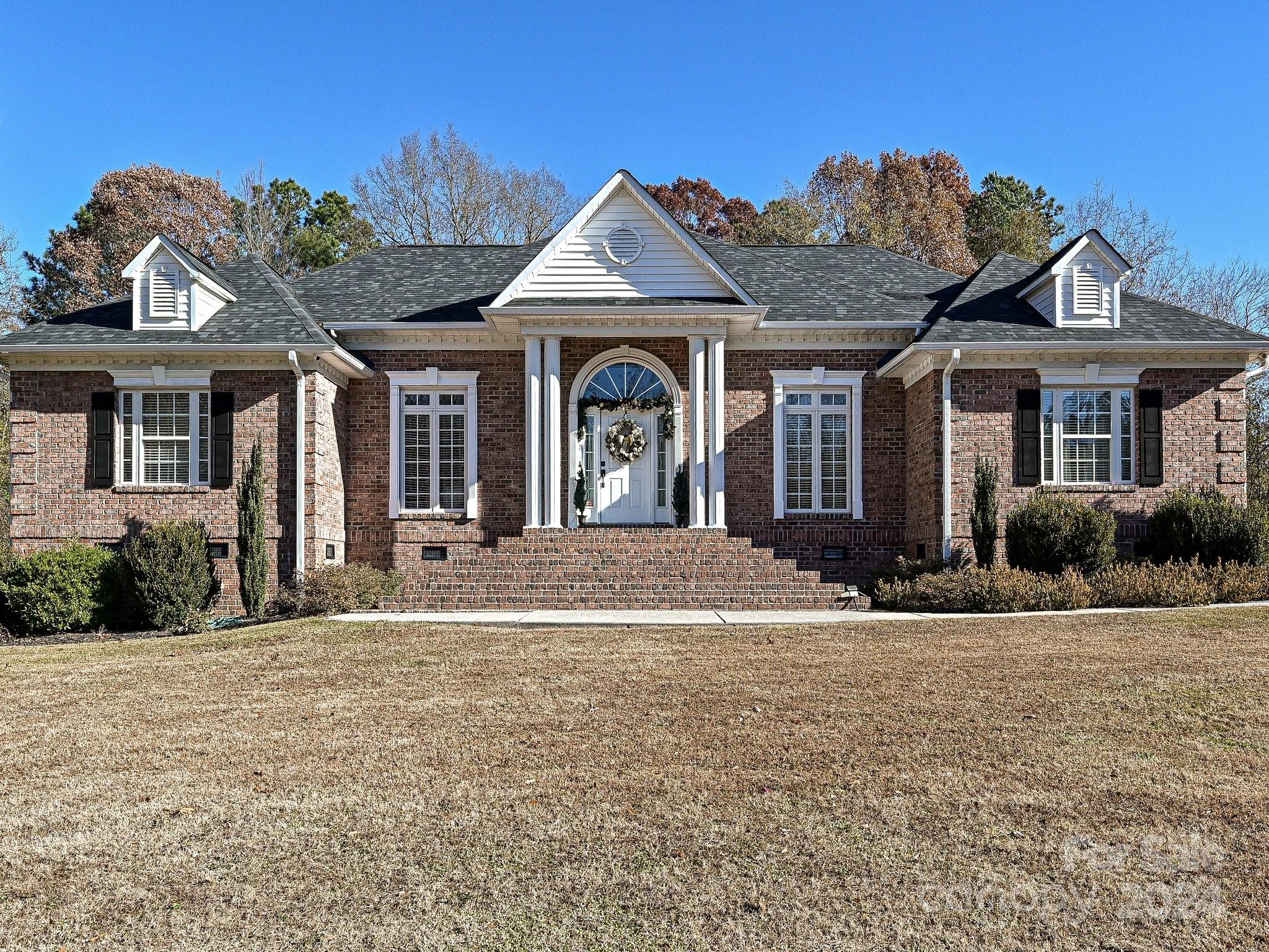 3203 Bentley Drive Lancaster, SC 29720 - Photo 1 of 45 a front view of a house with garden