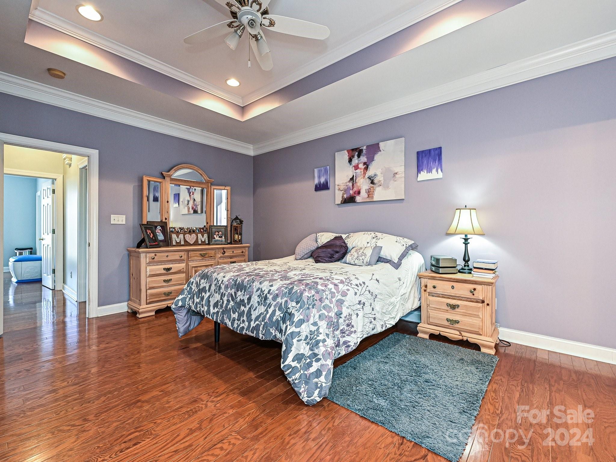 3203 Bentley Drive Lancaster, SC 29720 - Photo 24 of 45 a bedroom with a bed and a chandelier