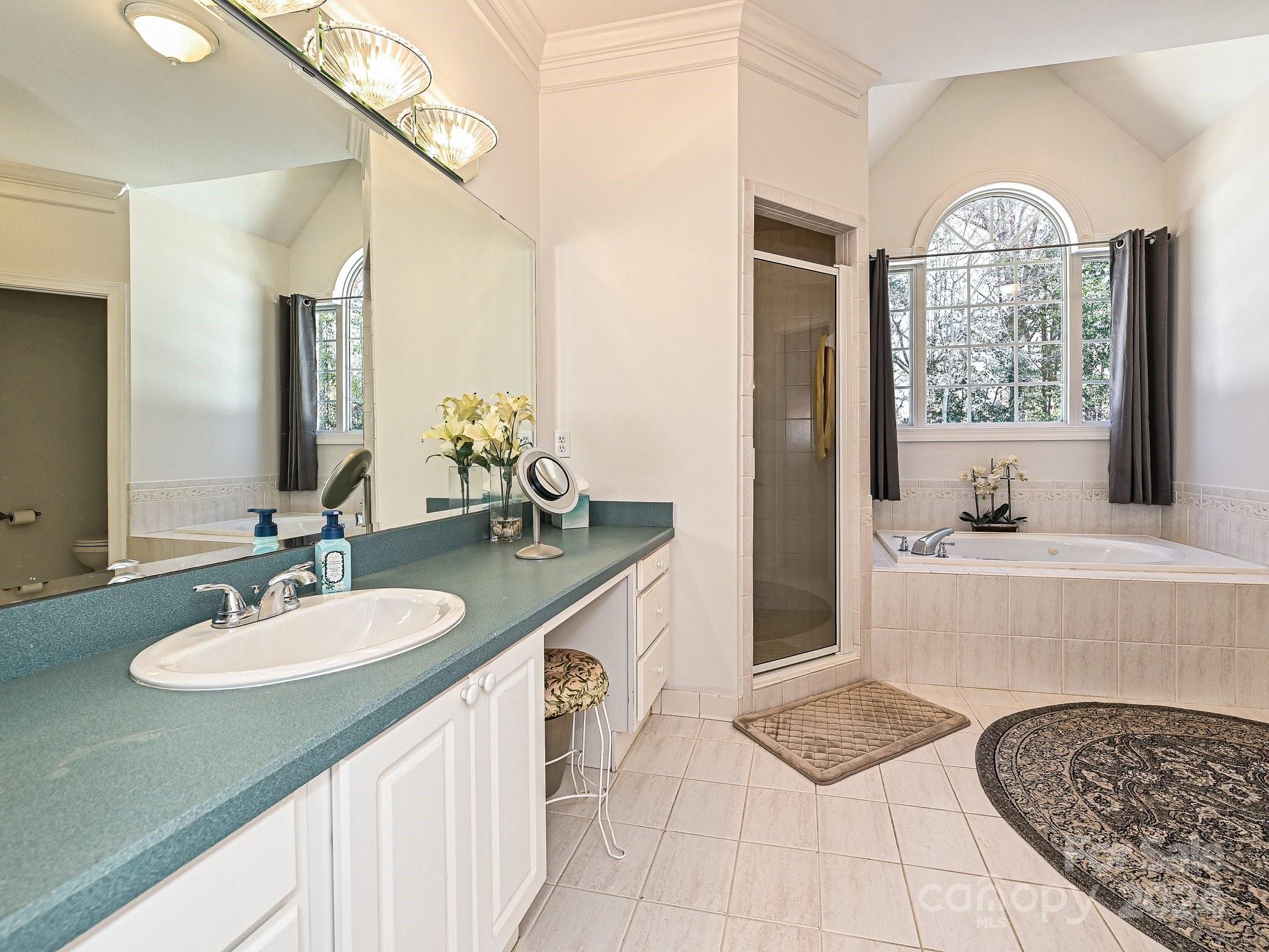 3203 Bentley Drive Lancaster, SC 29720 - Photo 26 of 45 a spacious bathroom with a sink double vanity and a mirror