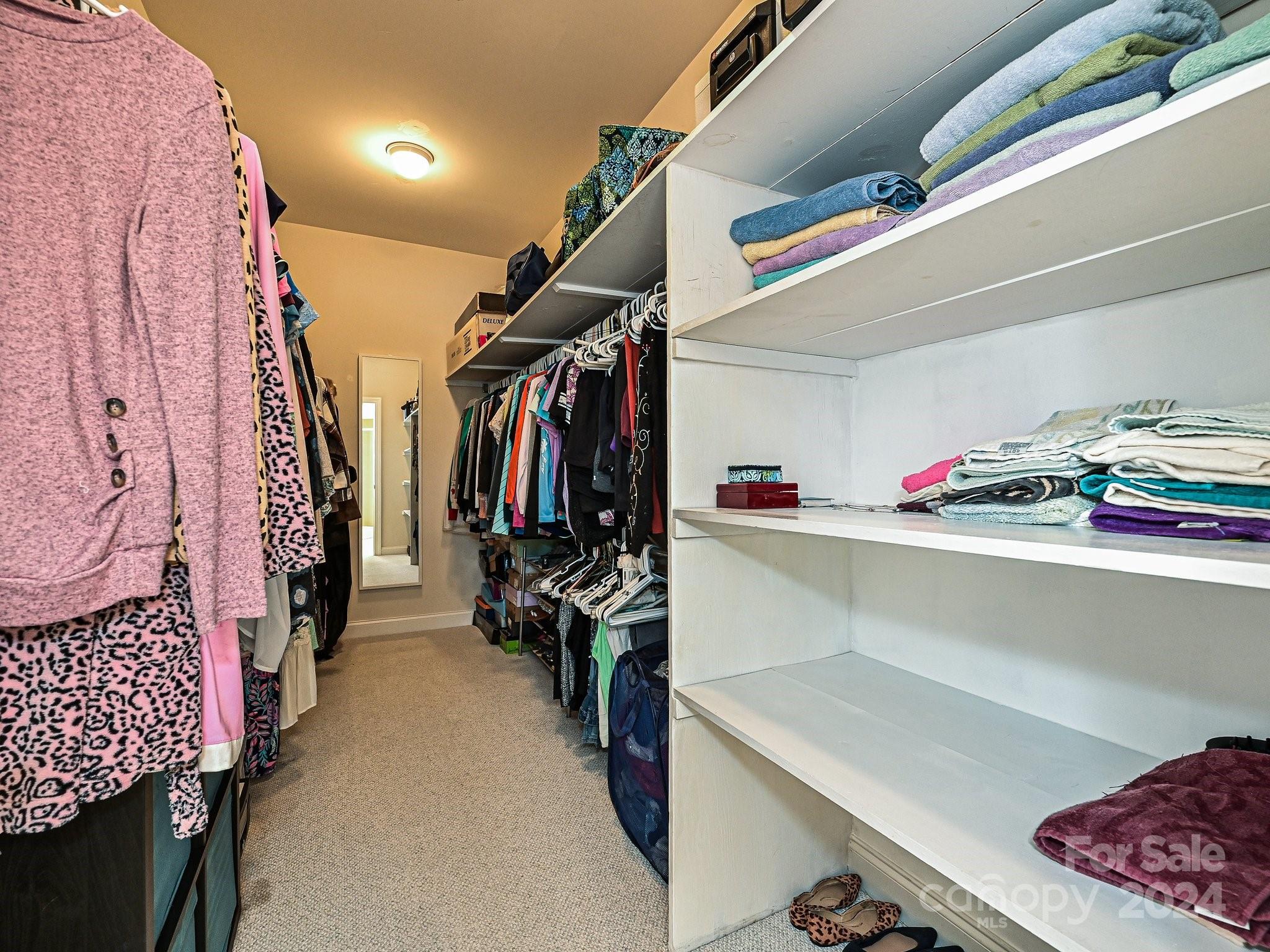 3203 Bentley Drive Lancaster, SC 29720 - Photo 28 of 45 a view of walk in closet with clothes and shoes