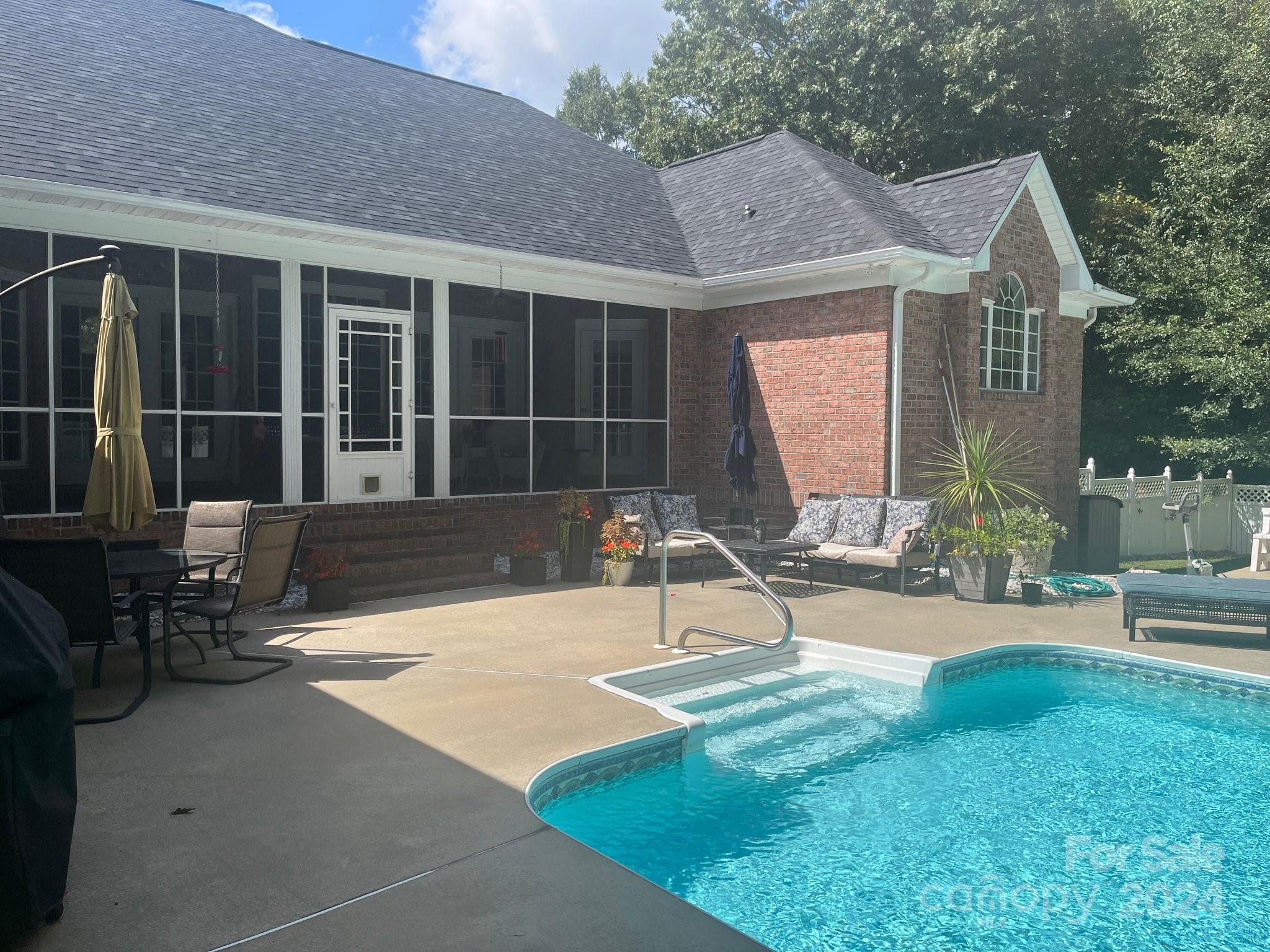 3203 Bentley Drive Lancaster, SC 29720 - Photo 42 of 45 a view of a house with backyard sitting area and garden