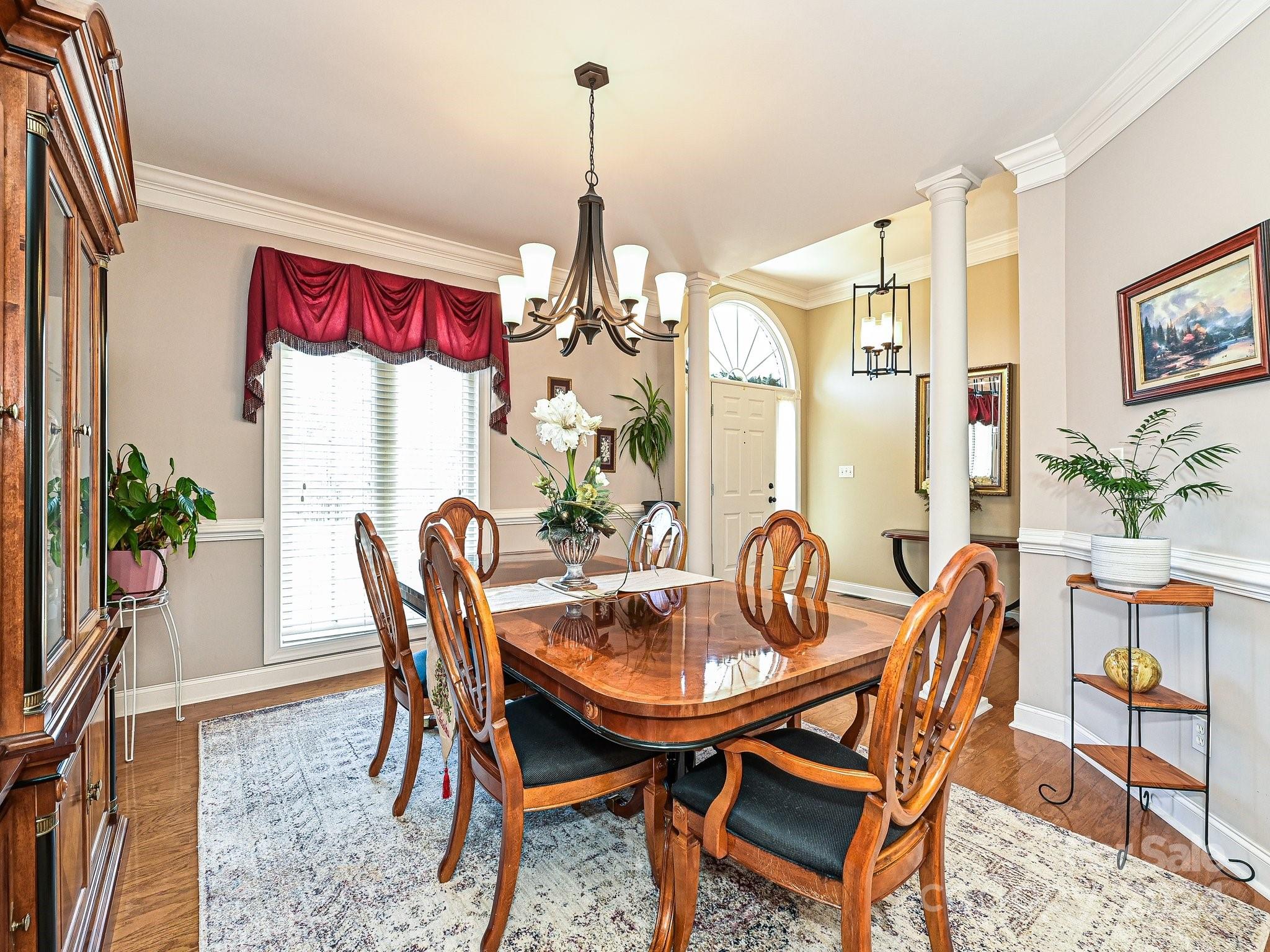 3203 Bentley Drive Lancaster, SC 29720 - Photo 5 of 45 a dining room with furniture a chandelier and window