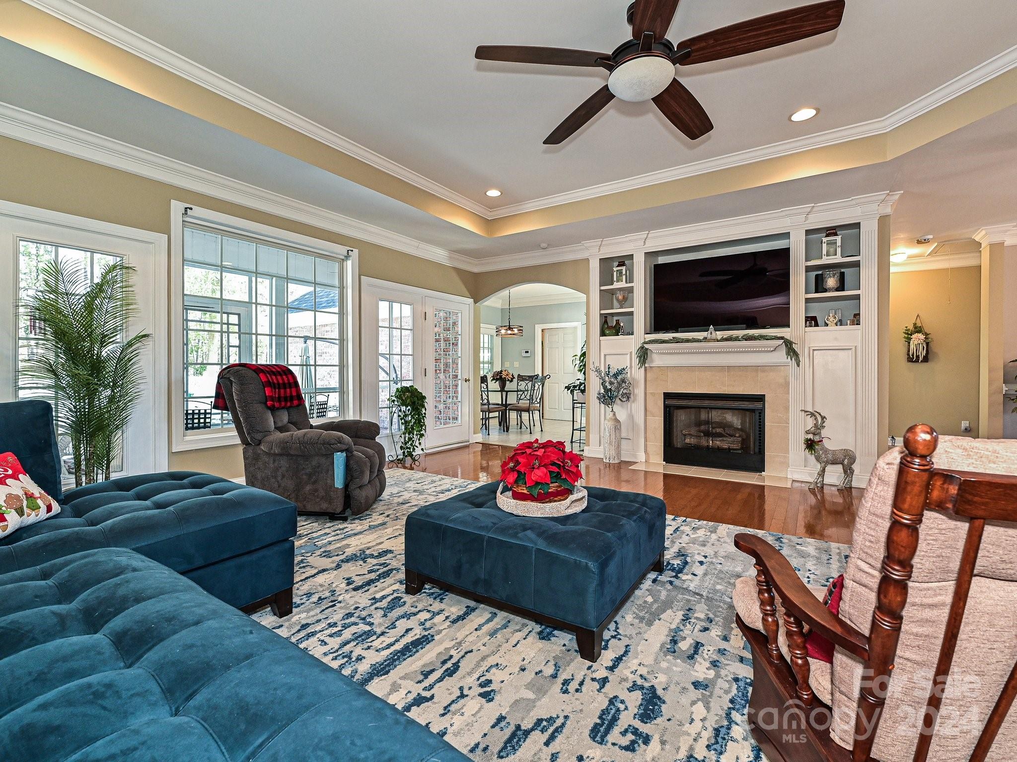 3203 Bentley Drive Lancaster, SC 29720 - Photo 9 of 45 a living room with furniture a fireplace and a flat screen tv