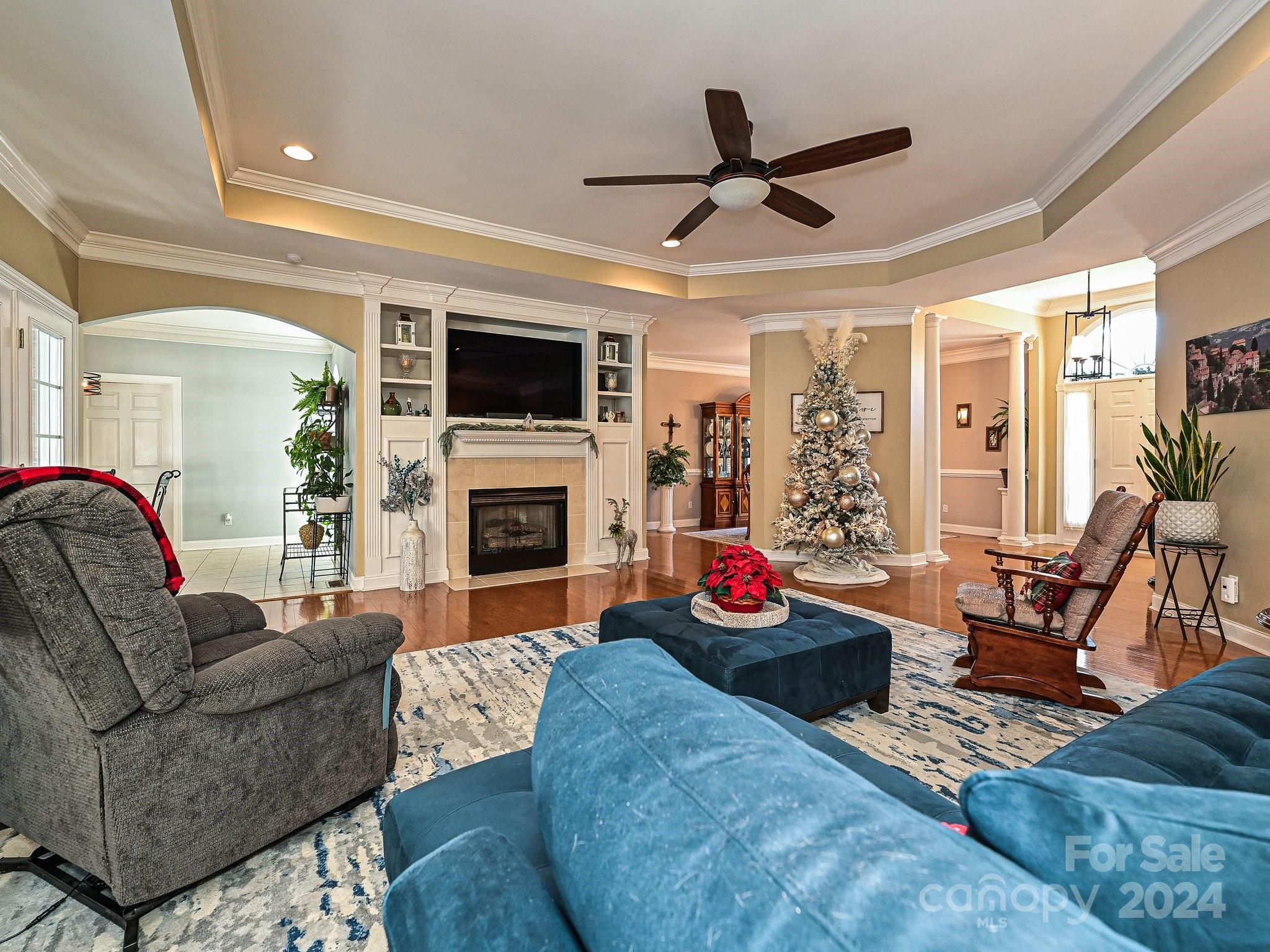 3203 Bentley Drive Lancaster, SC 29720 - Photo 10 of 45 a living room with furniture a fireplace and a flat screen tv