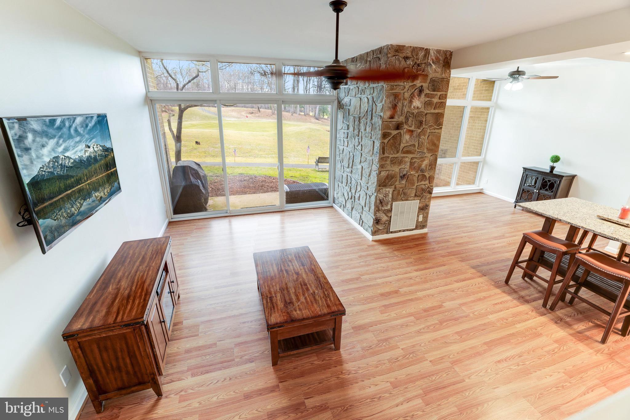 2122 Green Watch Way, Unit 10/101A Reston, VA 20191 - Photo 6 of 34 Walls of windows to enjoy the abundant nature.