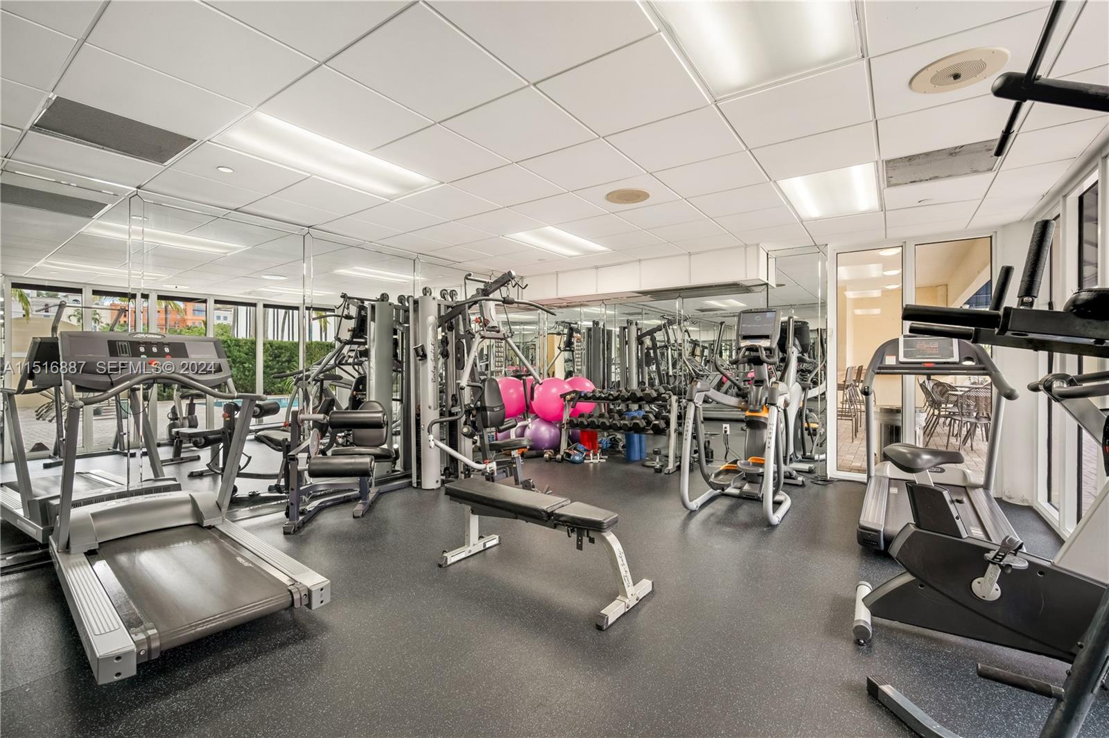 2351 Douglas Road, Unit 1207 Miami, FL 33145 - Photo 20 of 22 a view of a room with gym equipment