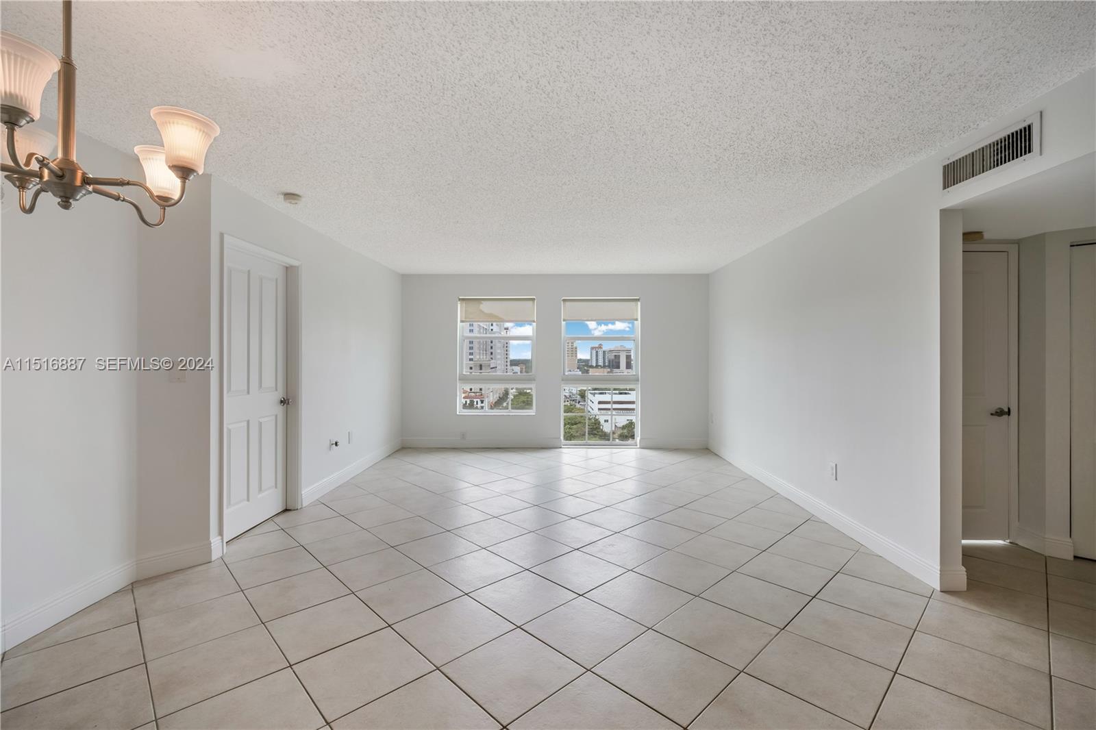 2351 Douglas Road, Unit 1207 Miami, FL 33145 - Photo 3 of 22 a view of an empty room with a window