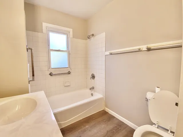 a bathroom with a bathtub and shower