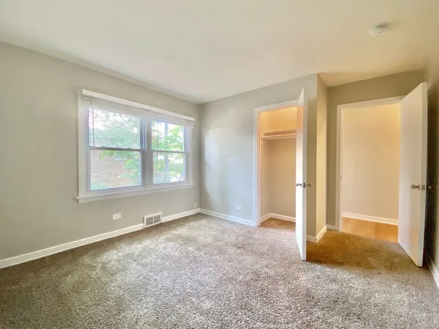 a big room with windows and closet