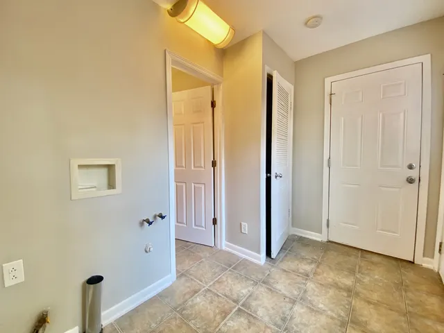 a view of a bathroom with a glass door shower and a sink