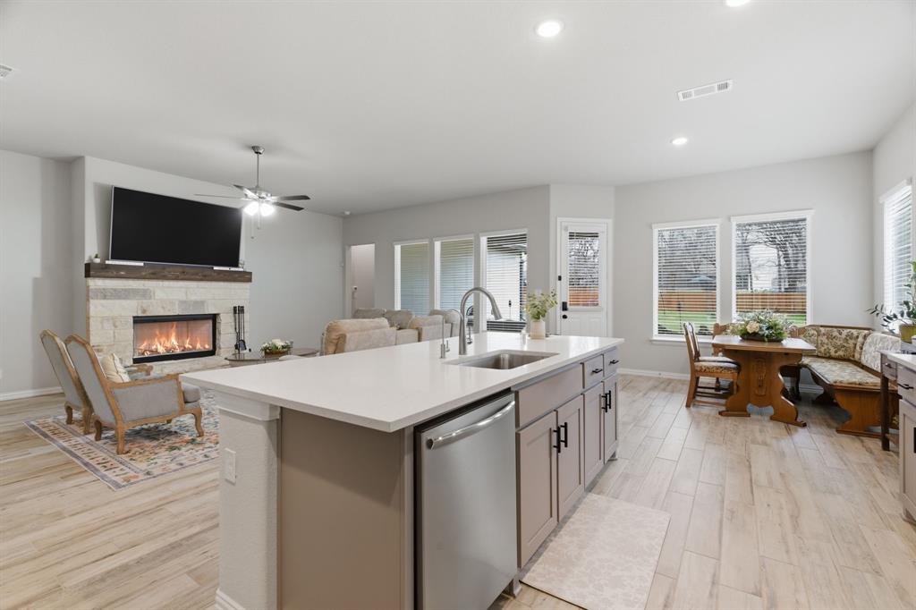 1117 Springfield Road Springtown, TX 76082 - Photo 12 of 40 a large kitchen with a counter space a sink appliances and cabinets
