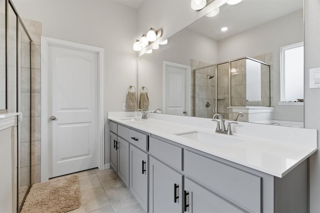 1117 Springfield Road Springtown, TX 76082 - Photo 20 of 40 a bathroom with a sink double vanity and a mirror