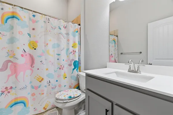 a bathroom with a sink and toilet