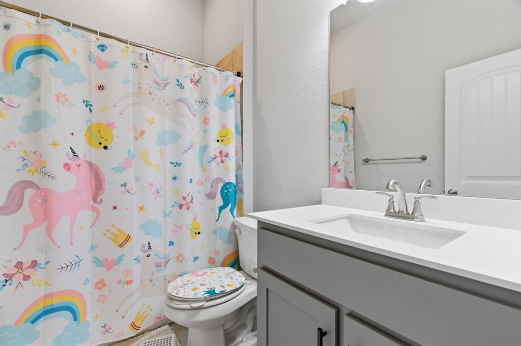 1117 Springfield Road Springtown, TX 76082 - Photo 24 of 40 a bathroom with a sink and toilet