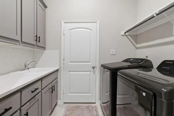 a view of walk in closet with cabinet