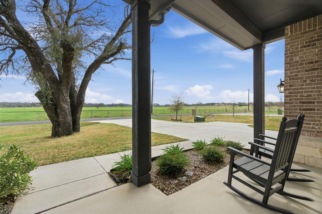 1117 Springfield Road Springtown, TX 76082 - Photo 34 of 40 a view of swimming pool with lake view and a large tree