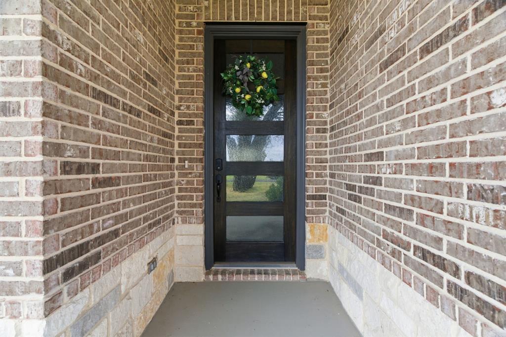 1117 Springfield Road Springtown, TX 76082 - Photo 5 of 40 a view of wooden door