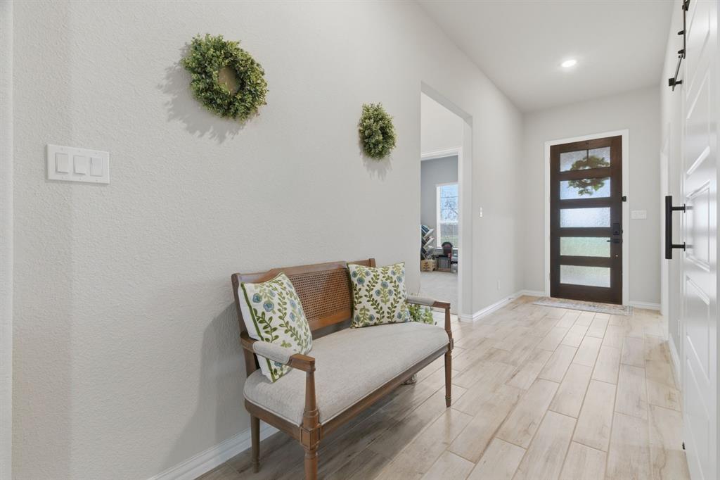 1117 Springfield Road Springtown, TX 76082 - Photo 5 of 40 a living room with furniture and wooden floor