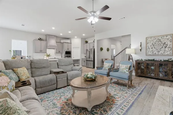 a living room with furniture and a rug