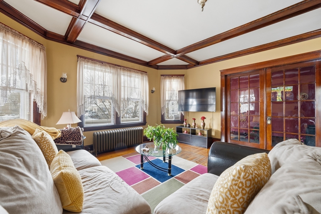 47 Houghton Street Worcester, MA 01604 - Photo 11 of 39 a living room with furniture and a large window