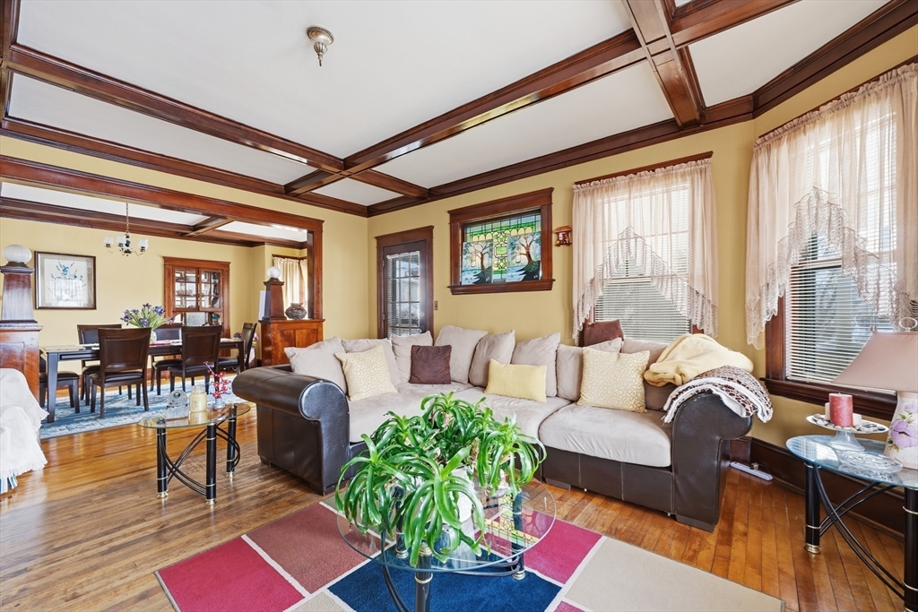 47 Houghton Street Worcester, MA 01604 - Photo 12 of 39 a living room with furniture fireplace and a large window