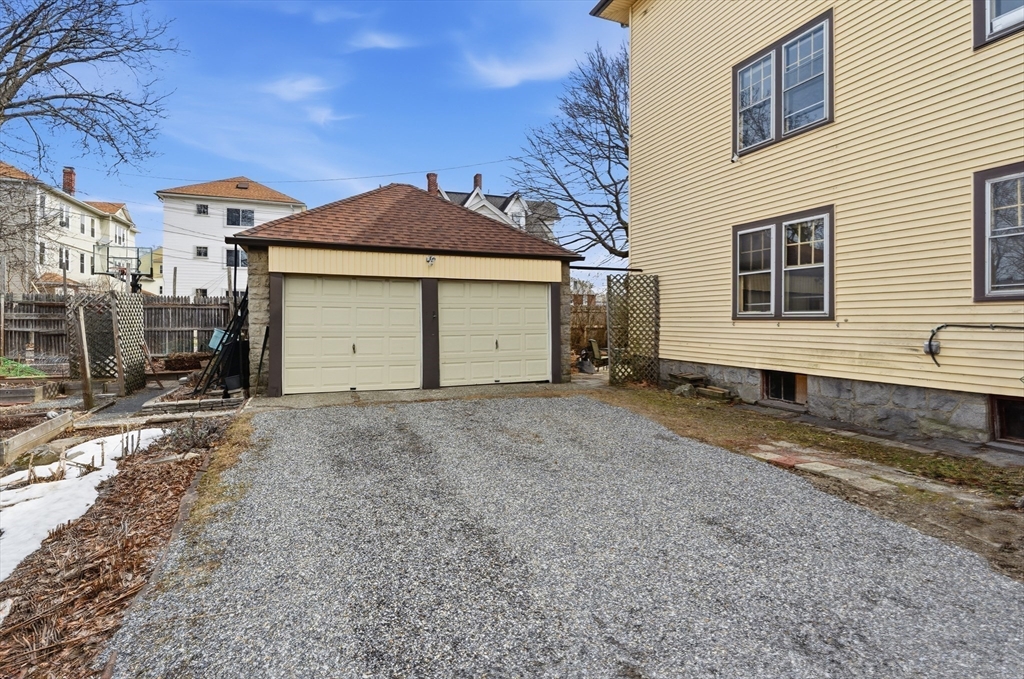 47 Houghton Street Worcester, MA 01604 - Photo 24 of 39 a view of a house with a yard