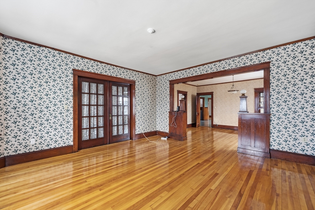 47 Houghton Street Worcester, MA 01604 - Photo 33 of 39 a view of empty room with wooden floor and fan