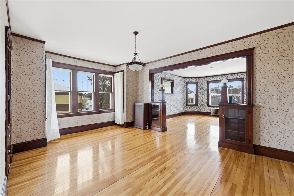 47 Houghton Street Worcester, MA 01604 - Photo 37 of 39 a view of an empty room with wooden floor and a window