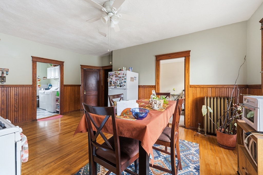 47 Houghton Street Worcester, MA 01604 - Photo 5 of 39 a dining room with furniture a chandelier and wooden floor