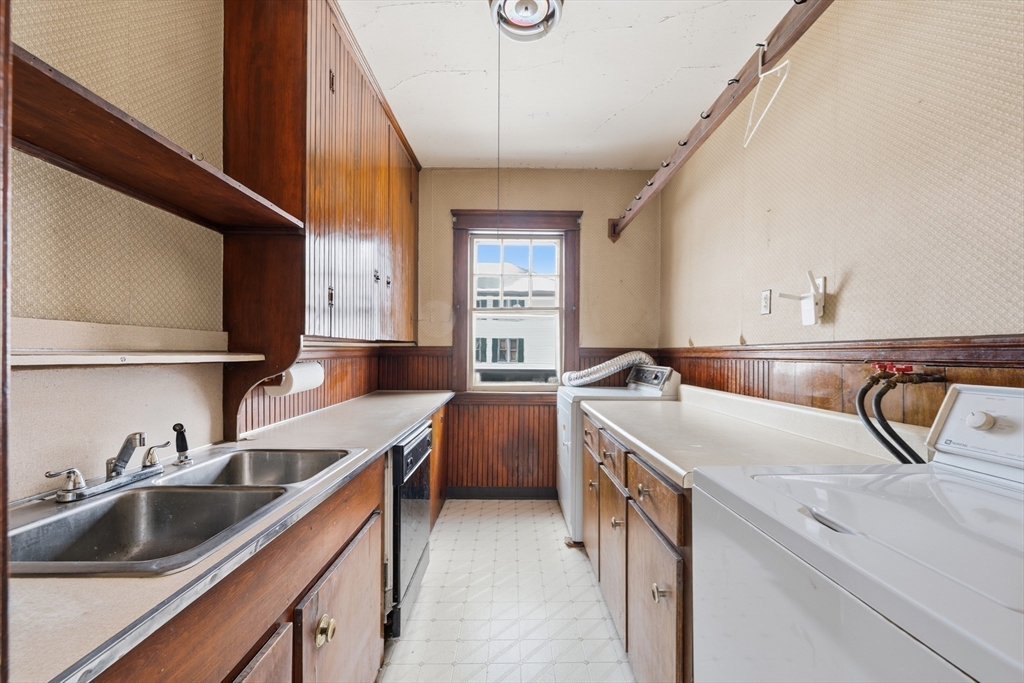 47 Houghton Street Worcester, MA 01604 - Photo 7 of 39 a kitchen with a sink and a stove top oven