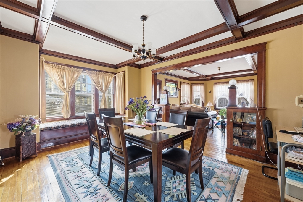 47 Houghton Street Worcester, MA 01604 - Photo 8 of 39 a dining room with furniture window and wooden floor
