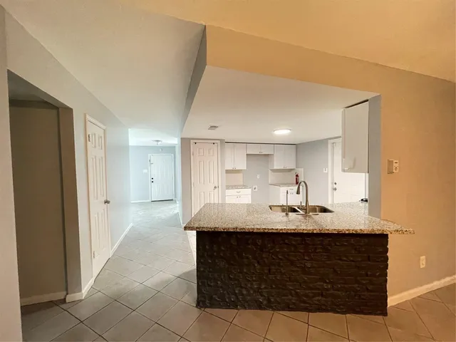 a bathroom with a sink vanity and a mirror
