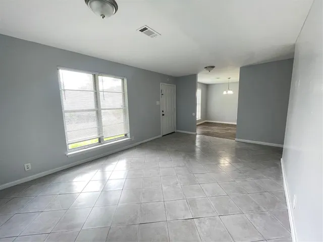 a view of an empty room with a window